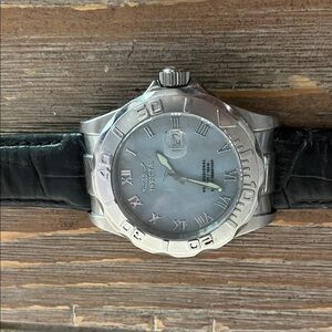 Invicta Silver Watch with Black Leather Strap.